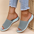 Light blue knitted mesh women's summer sliders for breathable orthopaedic comfort.