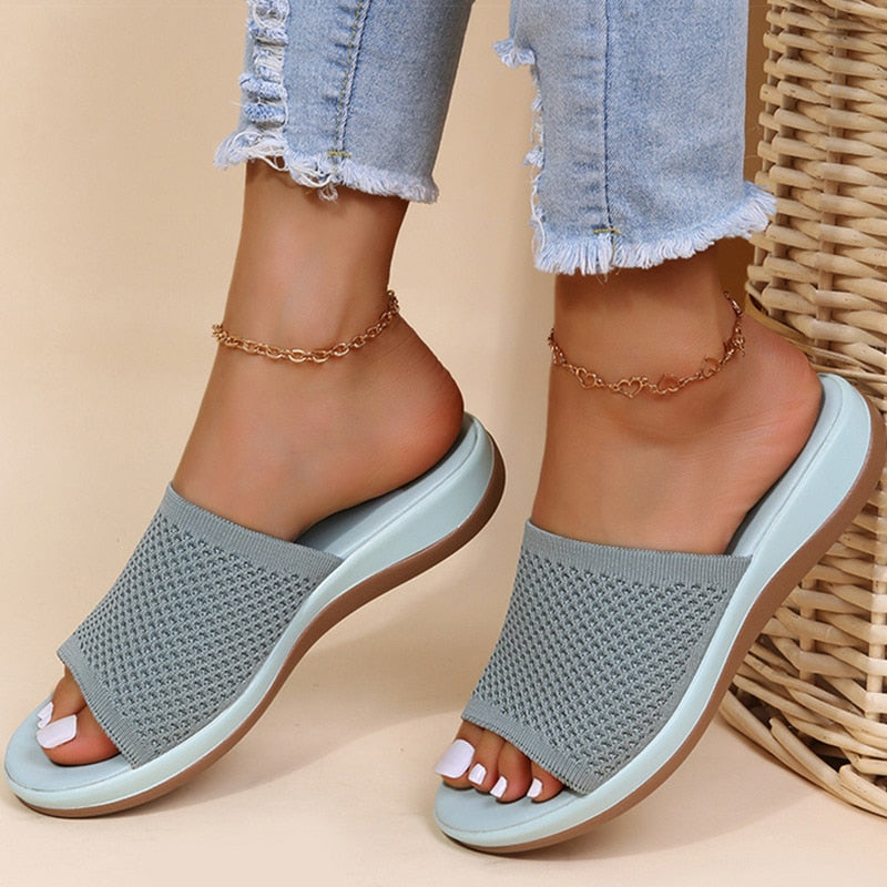 Light blue knitted mesh women's summer sliders for breathable orthopaedic comfort.
